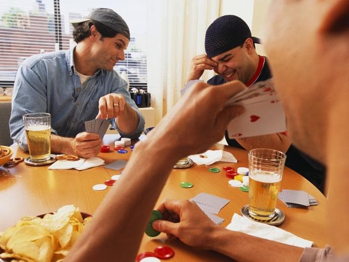 Three men playing poker