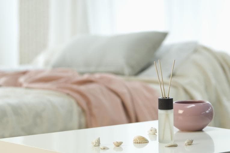 bedroom with reed diffuser