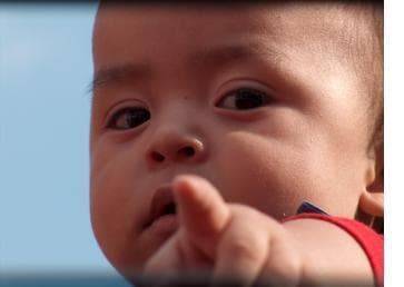 Infant pointing a finger