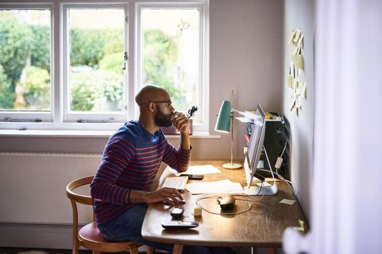 Man working on computer at home