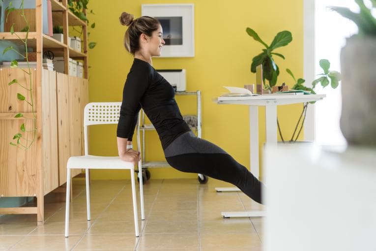 woman doing exercises at her desk