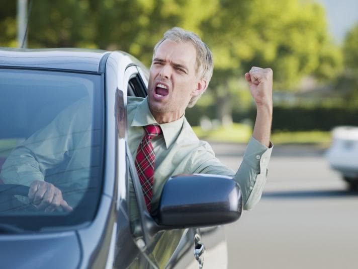 Angry driver shouting out of car window