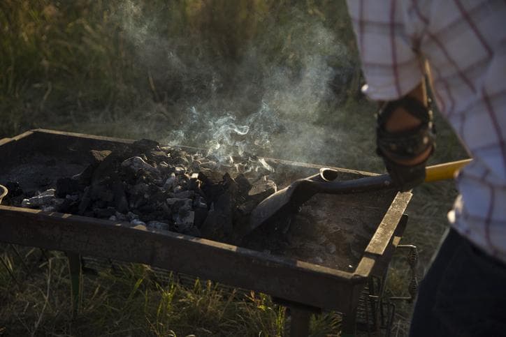 Man shovelling coal