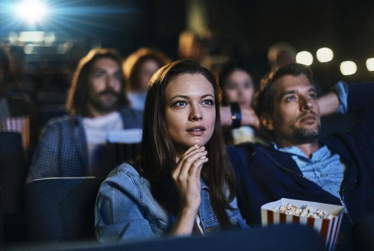 Couple watching a movie at the cinema