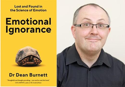 Dean Burnett next to his book cover