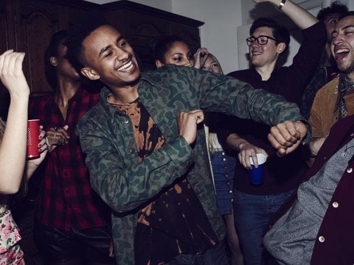 Group of friends dancing at a party