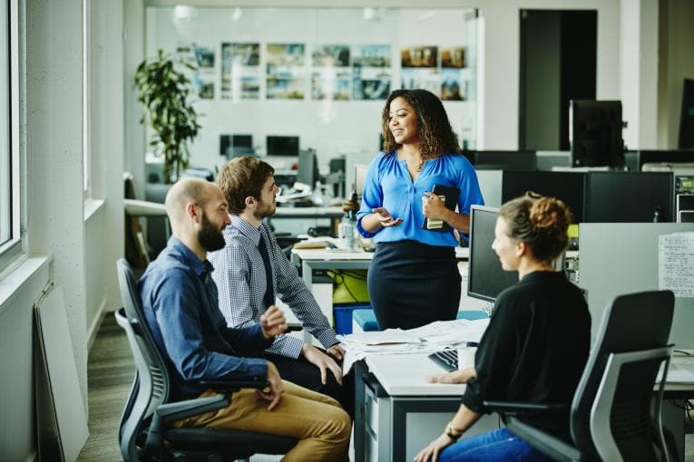 colleagues meeting around desk