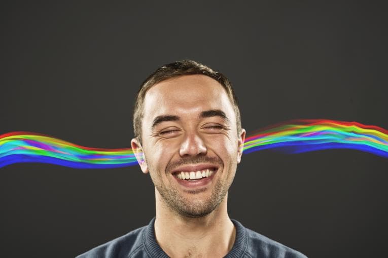 Man listening to musical waves