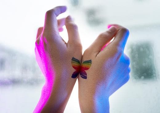 LGBTQ tattoo on hands