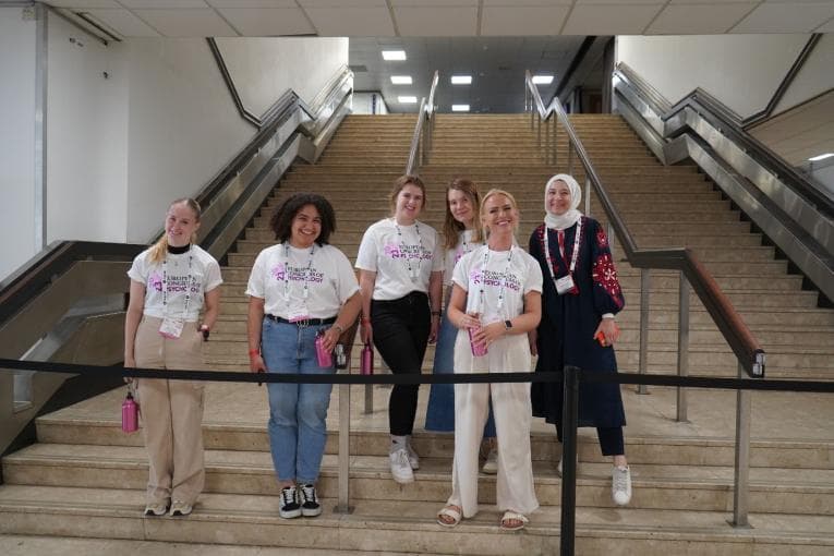 Student team at ECP 2023 in Brighton, standing on some steps