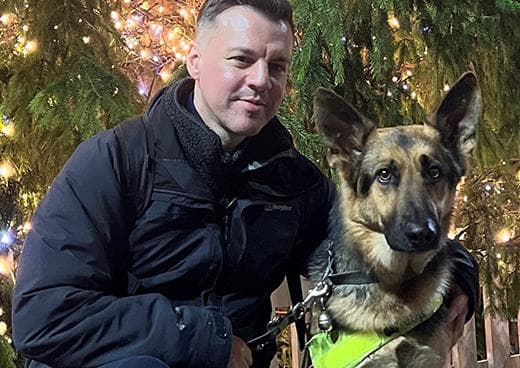 Stuart Gore with his assistance dog Pluto