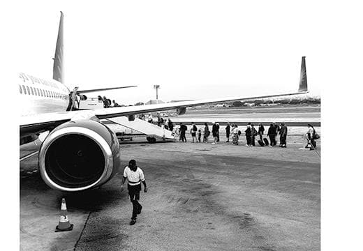 People boarding a plane