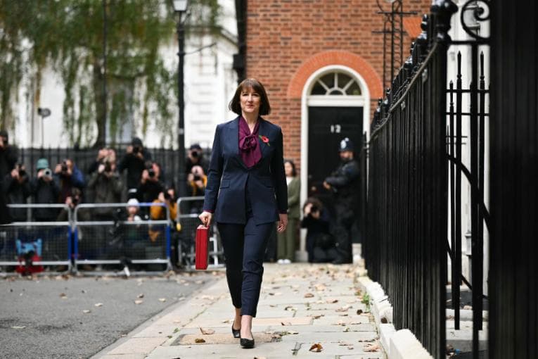 Chancellor Rachel Reeves walking down the street