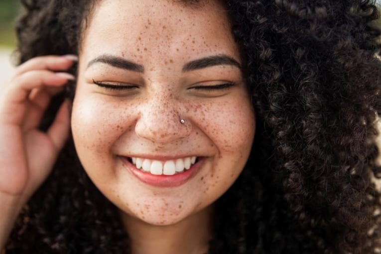 Person smiling widely