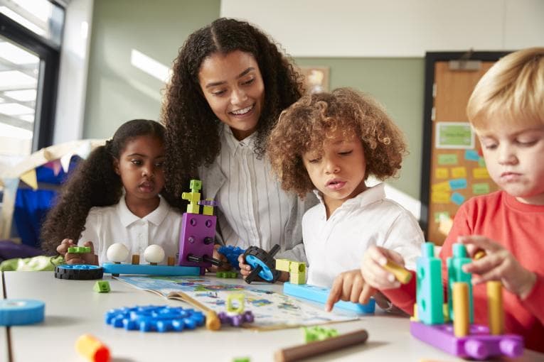 Children playing with teacher