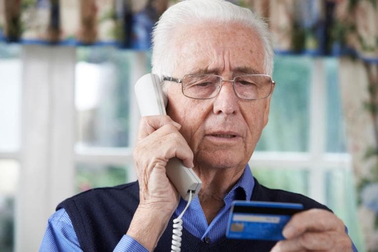 Older person answering the phone